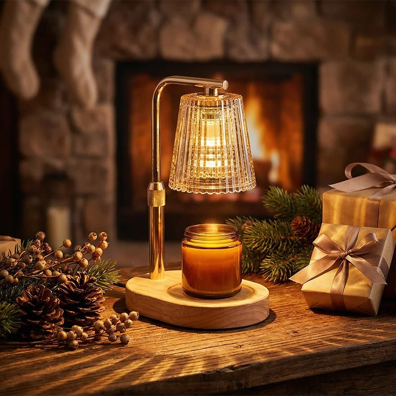 GatherGlow electric candle warmer lamp with walnut wood base and gold arm on a festive hearth, cozy glow melting a jar candle